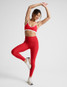 Beyond Yoga Women's Spacedye Strappy Sports Bra in Chili Red Heather front view