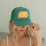 Local Beach Take it Easy Patch Trucker Hat in green front view