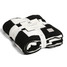 Checkered Reversible Throw Blanket in Black and White draped