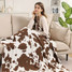 Cow Print Throw Blanket in Brown and White flat lay