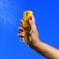 Vacation Body Mist bottle displayed at an angle on lifestyle background