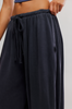 FP Movement Women's Momentum Pants in black, angled front view
