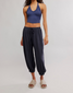 FP Movement Women's Momentum Pants in black, angled side view