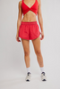 FP Movement Women's Now Or Never Shorts in grapefruit combo, front view
