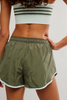 FP Movement Women's Now Or Never Shorts in ivy, back view