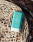 COOLA Classic SPF 30 Sunscreen Stick in Tropical Coconut side view