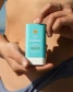 COOLA Classic SPF 30 Sunscreen Stick in Tropical Coconut application view