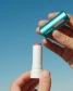 COOLA Liplux SPF 30 Tinted Lip Balm swatch and texture detail