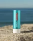 COOLA Liplux SPF 30 Tinted Lip Balm lid and container detail
