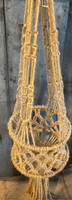 North American Crafters Macrame Plant Hanger, handcrafted boho-style hanging planter with intricate knotted design for home decor.