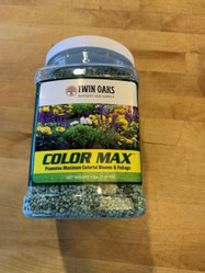 Sure Green Color Max Fertilizer (19-13-6), a container of fertilizer with colorful flowers on the label that promotes maximum colorful blooms and foliage.