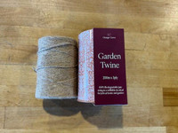 Orange Grove Garden Twine Tin, image of a spool of garden twine next to its product box.