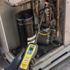 Fieldpiece DRX3 Refrigerant and Combustible Gas Leak Detector in use on rooftop unit