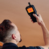 FLIR MR277 Professional Moisture Meter in hand above head