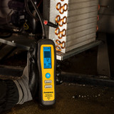 Fieldpiece DRX3 Refrigerant and Combustible Gas Leak Detector in use on coils