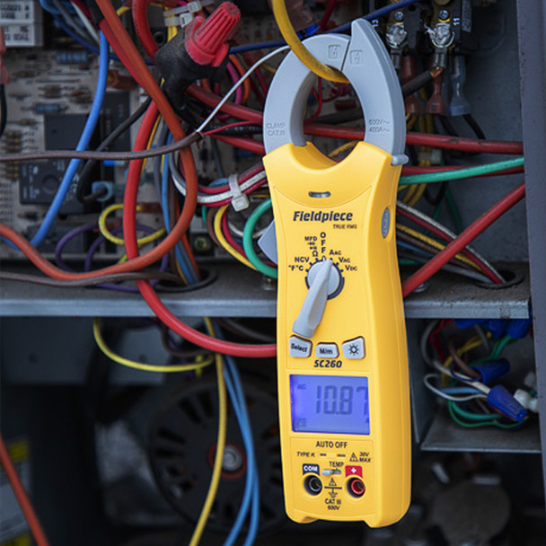 Fieldpiece SC260 Compact Clamp Meter with TRUE RMS hanging from clamp
