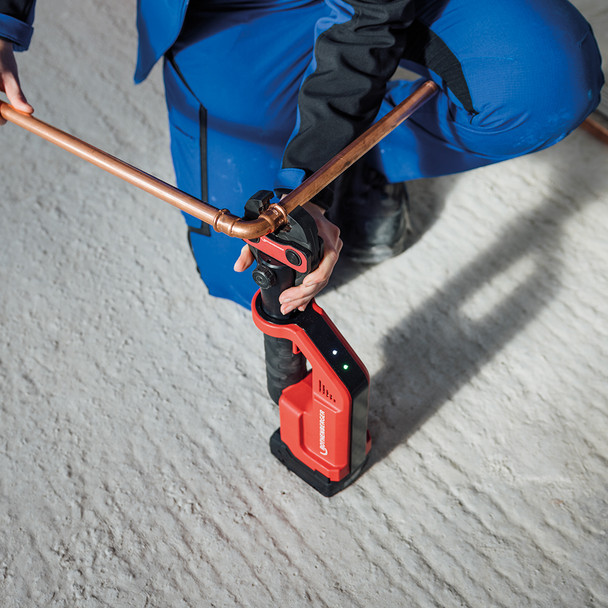 Rothenberger ROMAX Compact III Lightweight Cordless Press Tool in use on ground