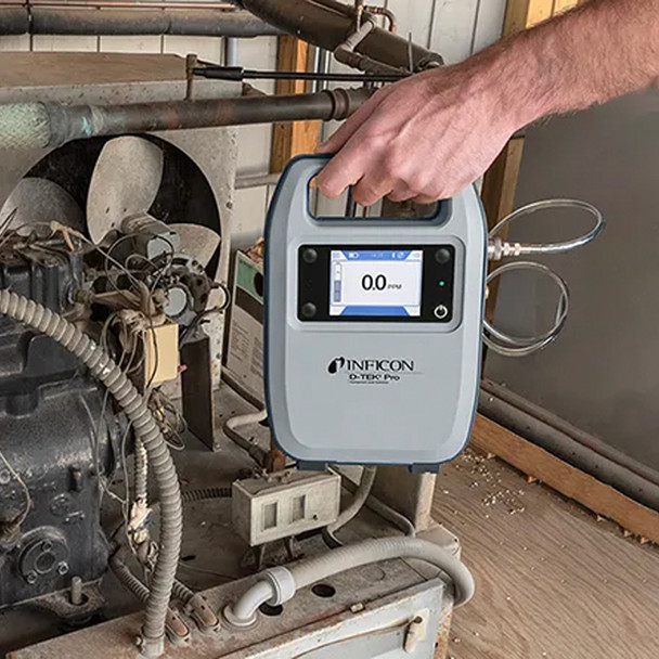 Inficon D-TEK Pro Refrigerant Leak Detector in hand
