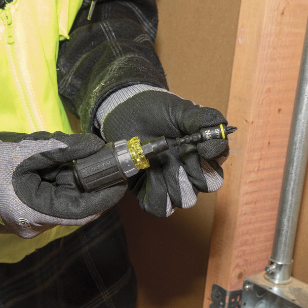 Klein Tools KNECT™ 7-in-1 Ratcheting Impact Rated Stubby Screwdriver in use swapping tips