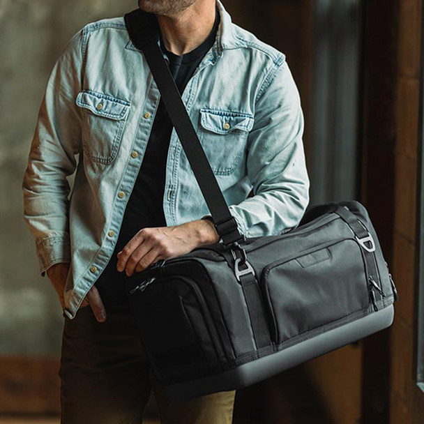 Norwalk+ By Veto 40L Duffel Bag hanging off shoulder