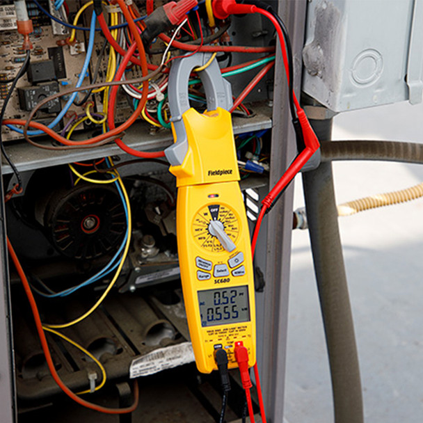 Fieldpiece SC680 True-RMS Wireless AC Clamp Multimeter hanging from wires