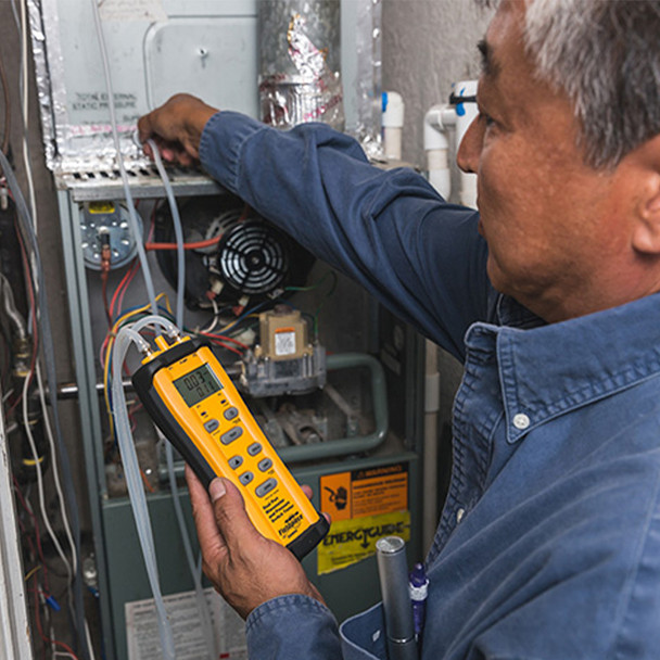 Fieldpiece SDMN6 Dual-Port Manometer and Pressure Switch Tester in use