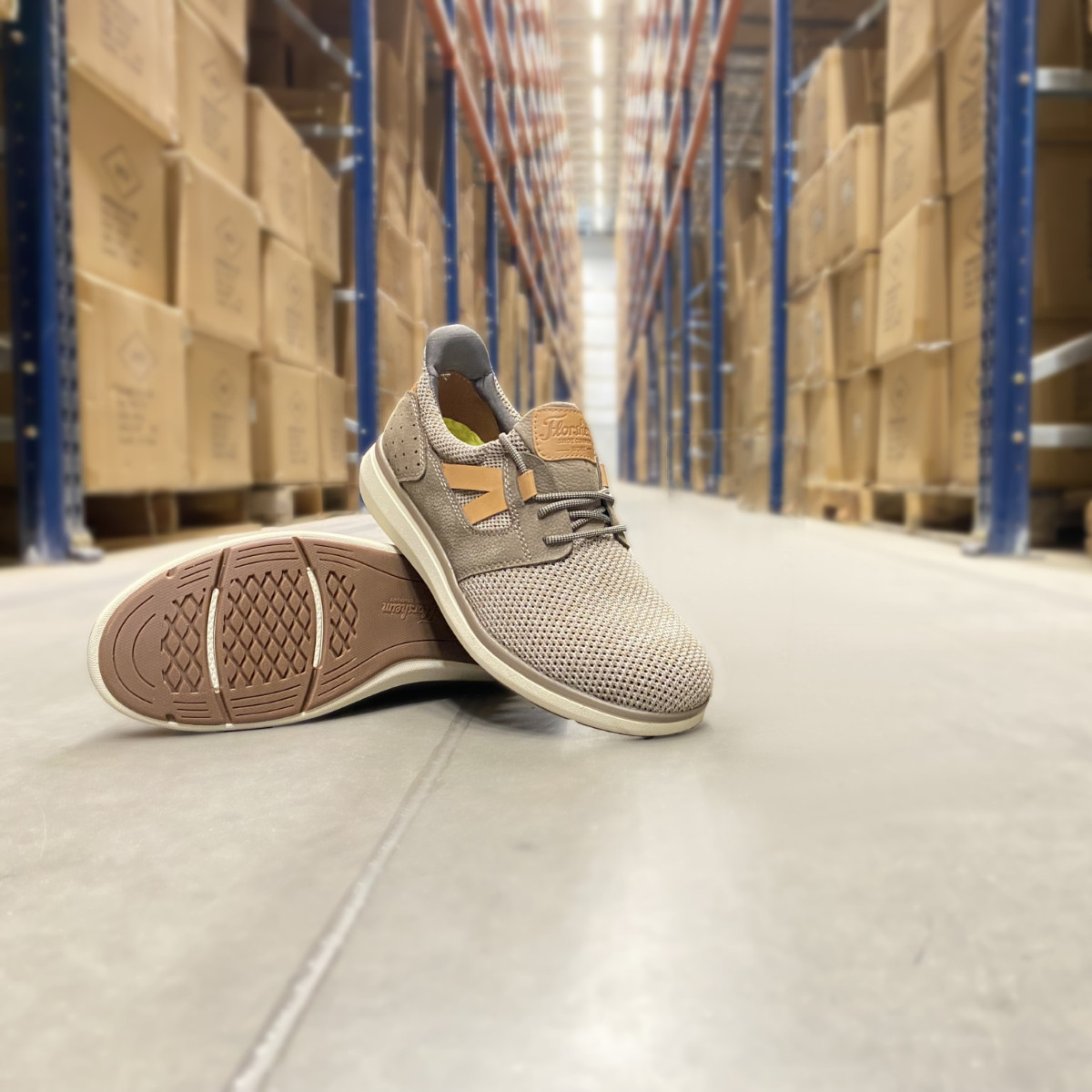 Adventure Men's Mushroom Casual Work Oxford - FS2473 Adventure Men's FS2473 Mushroom Casual Work Oxford shoes with breathable knit uppers and white slip-resistant soles, displayed on a warehouse aisle floor among stacked boxes.