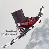 Mountain terrain view with boot in snowshoe showing heel lift feature for steep uphill traction Mountain terrain view with boot in snowshoe showing heel lift feature for steep uphill traction