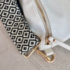 Black/cream pattern bag strap-with white belt bag