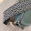 Black/cream pattern bag strap-with green belt bag