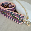 White belt bag with pink patterned strap