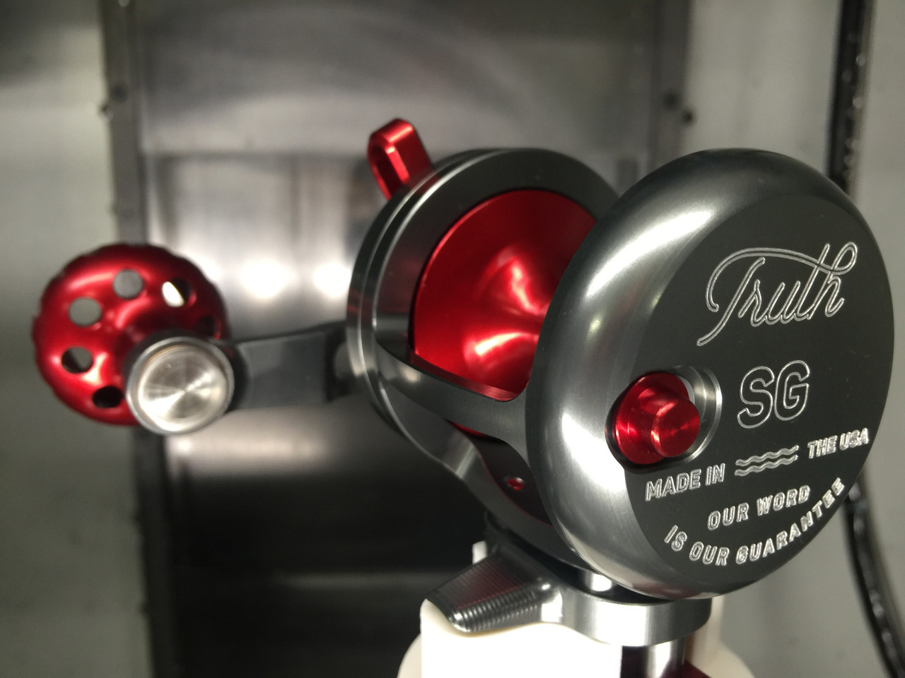 Seigler Reel SG Smoke w/ Red Accents LH - alltackle.com