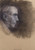 Profile portrait of an elderly man on toned tan paper. He's bald, looking to the right, has pronounced nose and well defined facial features. Background is toned with dark charcoal.