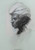 Portrait of a man wearing a turban. He's looking to the left, it's almost a profile view of his face. This charcoal portrait has deep tonal values.
