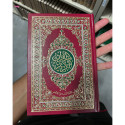 Front cover image of the book "Mushaf Al Quran Al Kareem Red with Decorated Gold and Green Cover Medium Size (7.7" x 5.5")"