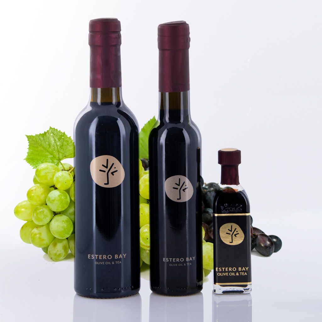 Three different size bottles of Estero Bay Olive Oil & Tea 18yr Traditional Dark Balsamic Vinegar.