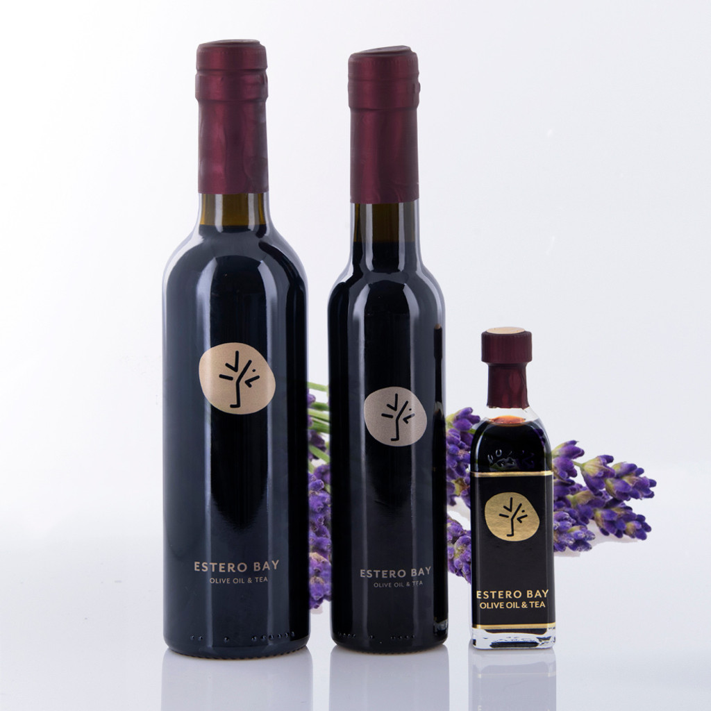 Three different size bottles of Estero Bay Olive Oil & Tea Lavender  Dark Balsamic Vinegar.