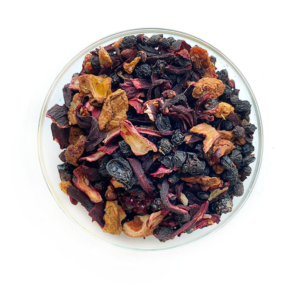 A pile of Estero Bay Olive Oil and Tea lose leaf Grandma's Garden blended with Elderberries, hibiscus blossoms, apple pieces, blackcurrants, flavoring, freeze-dried whole blackberries, freeze-dried strawberry pieces, freeze-dried raspberry pieces, wild strawberry leaves.