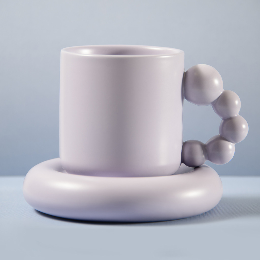 a Photo of a Purple Fun Bubble Handle Mug With Saucer Blue Background 1280