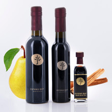 Three different size bottles of Estero Bay Olive Oil & Tea Cinnamon Pear Dark Balsamic Vinegar.