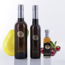 Three different size bottles of Estero Bay Olive Oil & Tea Cranberry Pear White Balsamic Vinegar.