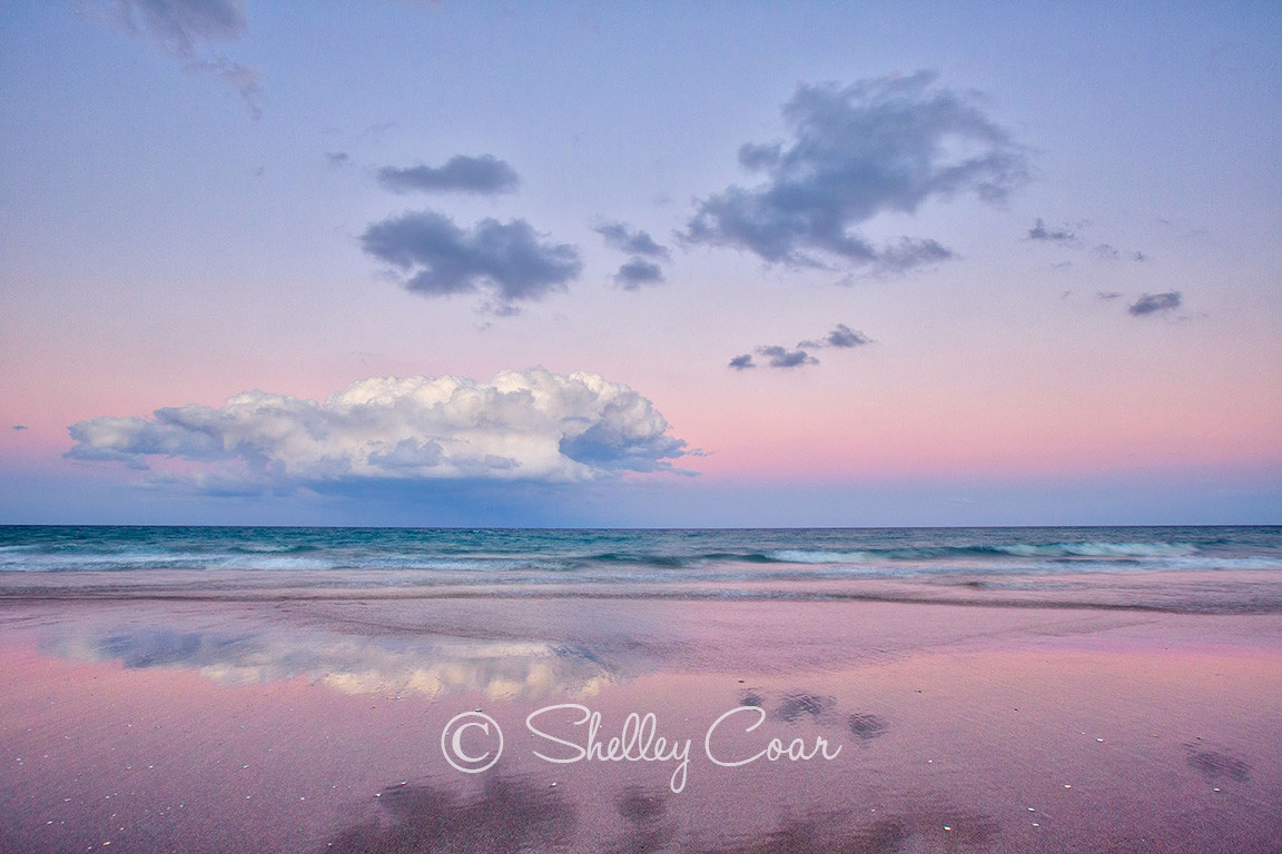 A beach sunset overlooking the Atlantic Ocean at Boca Raton, Florida. Landscape photograph by Shelley Coar.