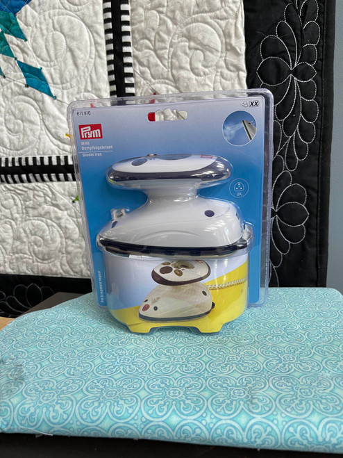 Mini Steam Iron for needlework, quilting & precision ironing with steady steam flow, ergonomic design & measuring cup, ideal travel accessory. Mini Steam Iron for needlework, quilting & precision ironing with steady steam flow, ergonomic design & measuring cup, ideal travel accessory.