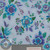 Lavender floral fabric designed by Chong A Hwang, 100% cotton, wide repeat pattern with flower design on pale blue background for quilting or sewing projects.