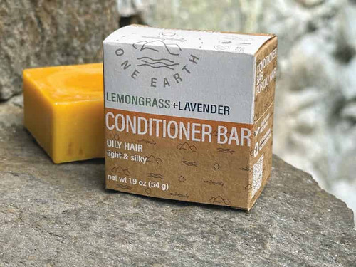 One Earth Body Care Conditioner Bar for Oily Hair, Lemongrass-Lavender aroma. Naked square conditioner bar next to compostable box package.