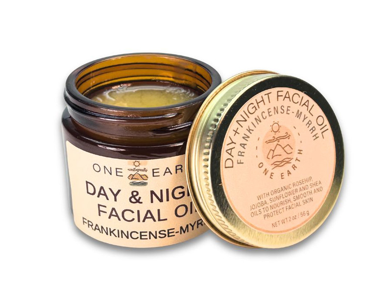 One Earth Body Care Day & Night Facial Oil in amber glass jar, Lid off, Frankincense-Myrrh 2 oz