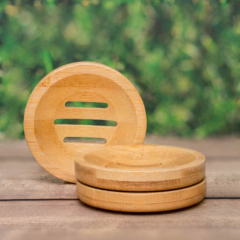 Round bamboo dish for shampoo bars and conditioner bars, with slots to let water drain