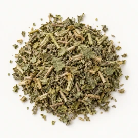 Image - Loose dried blessed thistle on a warm-white background.