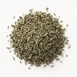 Image - Loose dried thyme on a warm-white background.