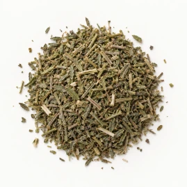 Image - Loose dried hyssop herb on a warm-white background.